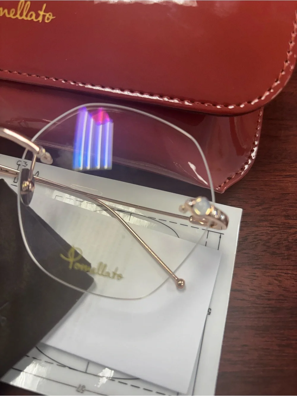 Pomellato Gold Rimless Glasses with Red Case
